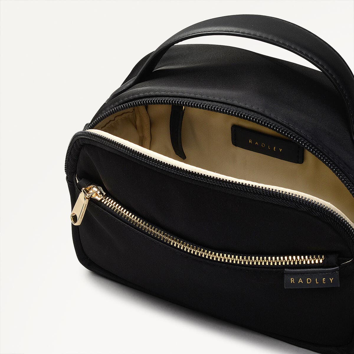 Montague Lane Fabric Mini Zip Around Crossbody Bag in Black - 110402