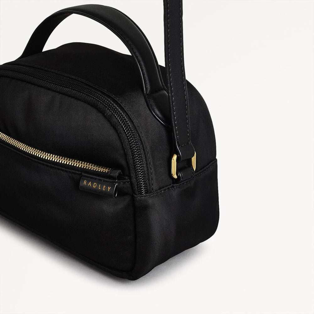 Montague Lane Fabric Mini Zip Around Crossbody Bag in Black - 110402