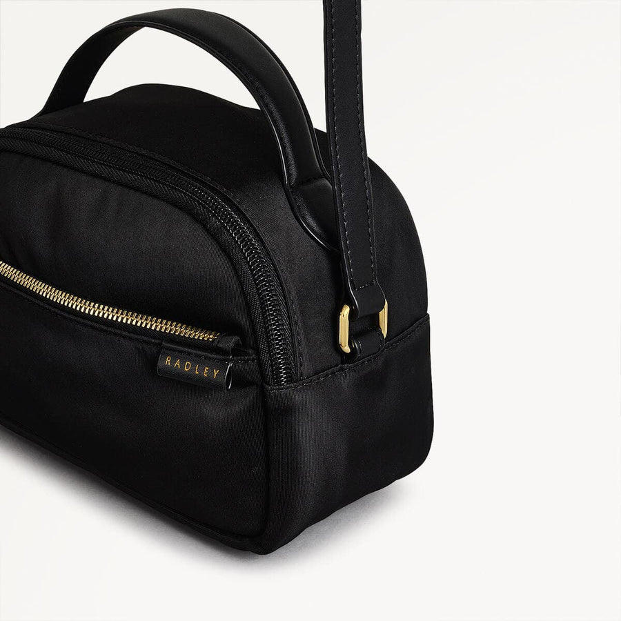 Montague Lane Fabric Mini Zip Around Crossbody Bag in Black - 110402