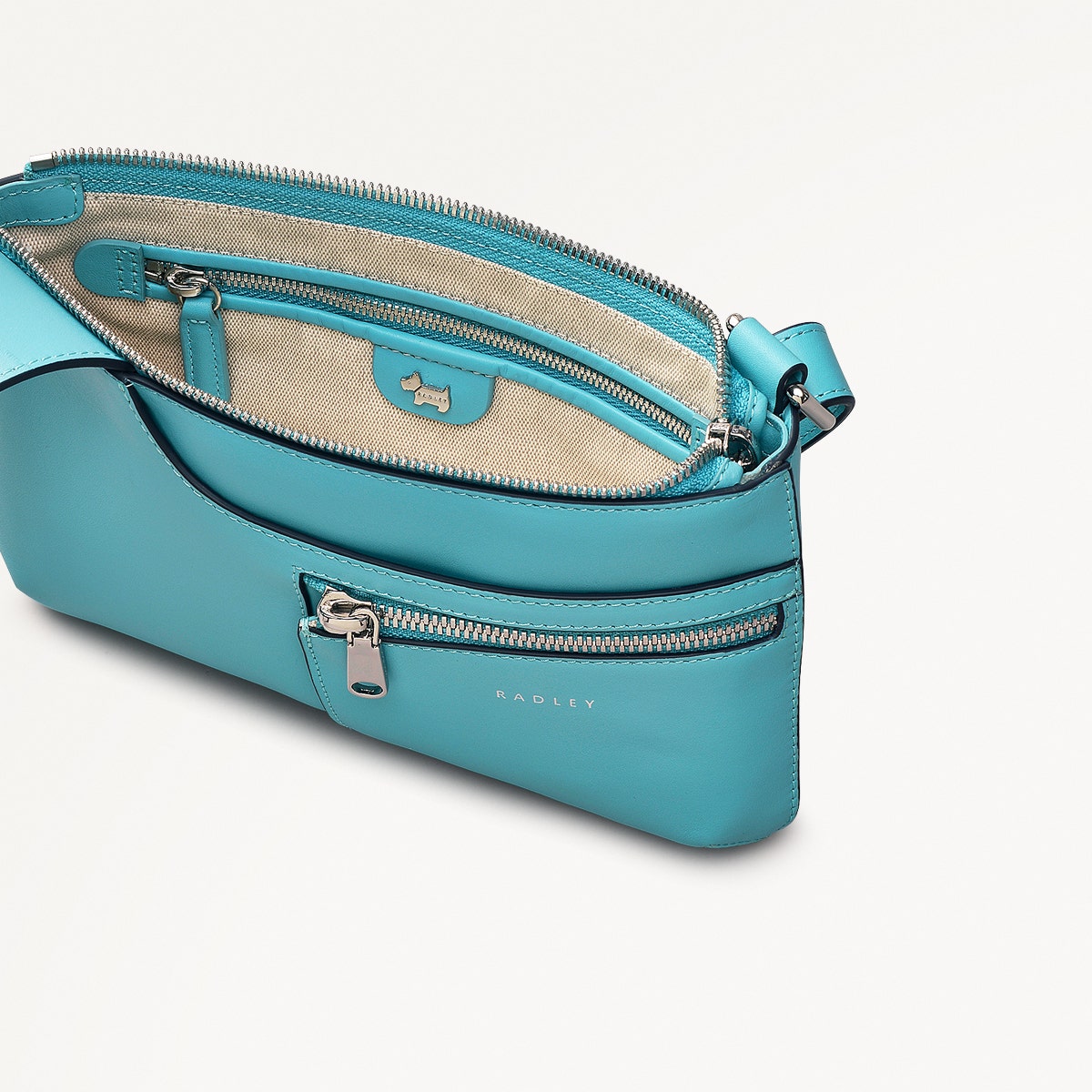Pockets Leather Mini Ziptop Cross Body Bag in Maldives - 111448