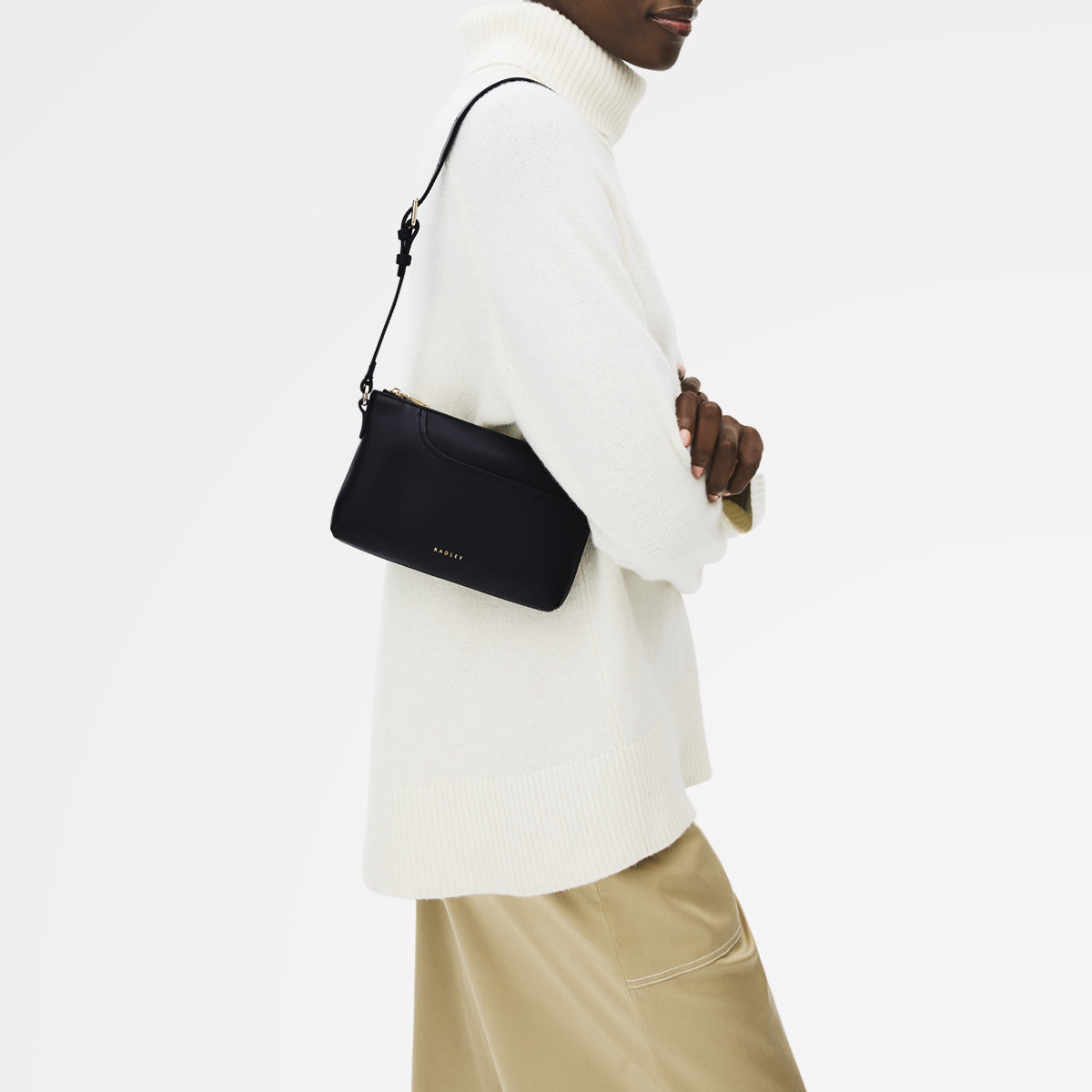 Pockets Leather Mini Ziptop EW Shoulder Bag in Black - 112144