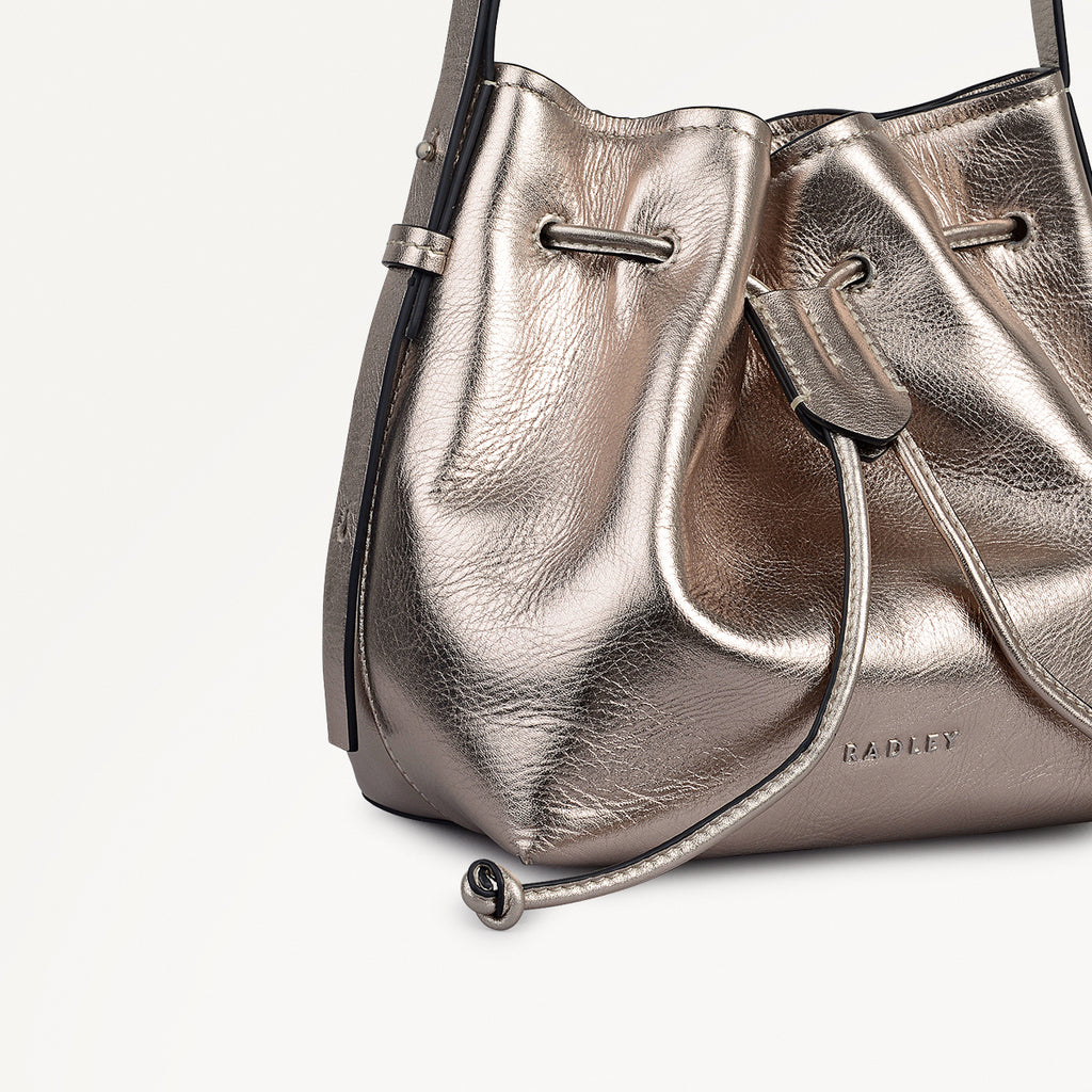 YORK MEWS - METALLIC SMALL DRAWSTRING SHOULDER PYRITE