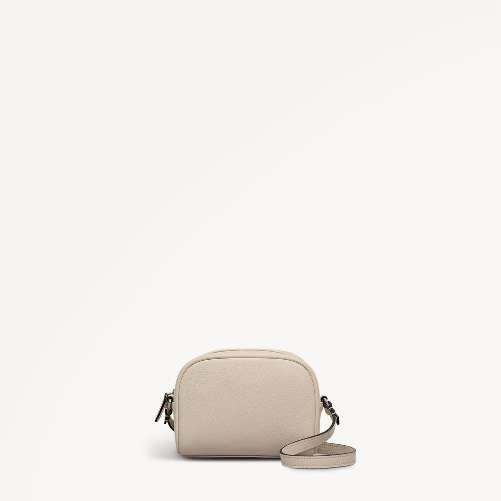 THE DAILY SMALL ZIP AROUND CROSS BODY SALT