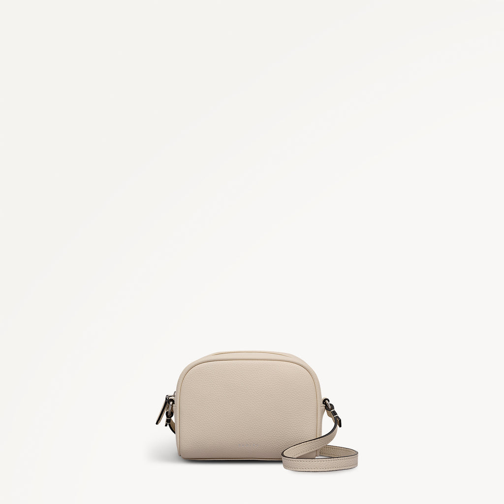 THE DAILY SMALL ZIP AROUND CROSS BODY SALT
