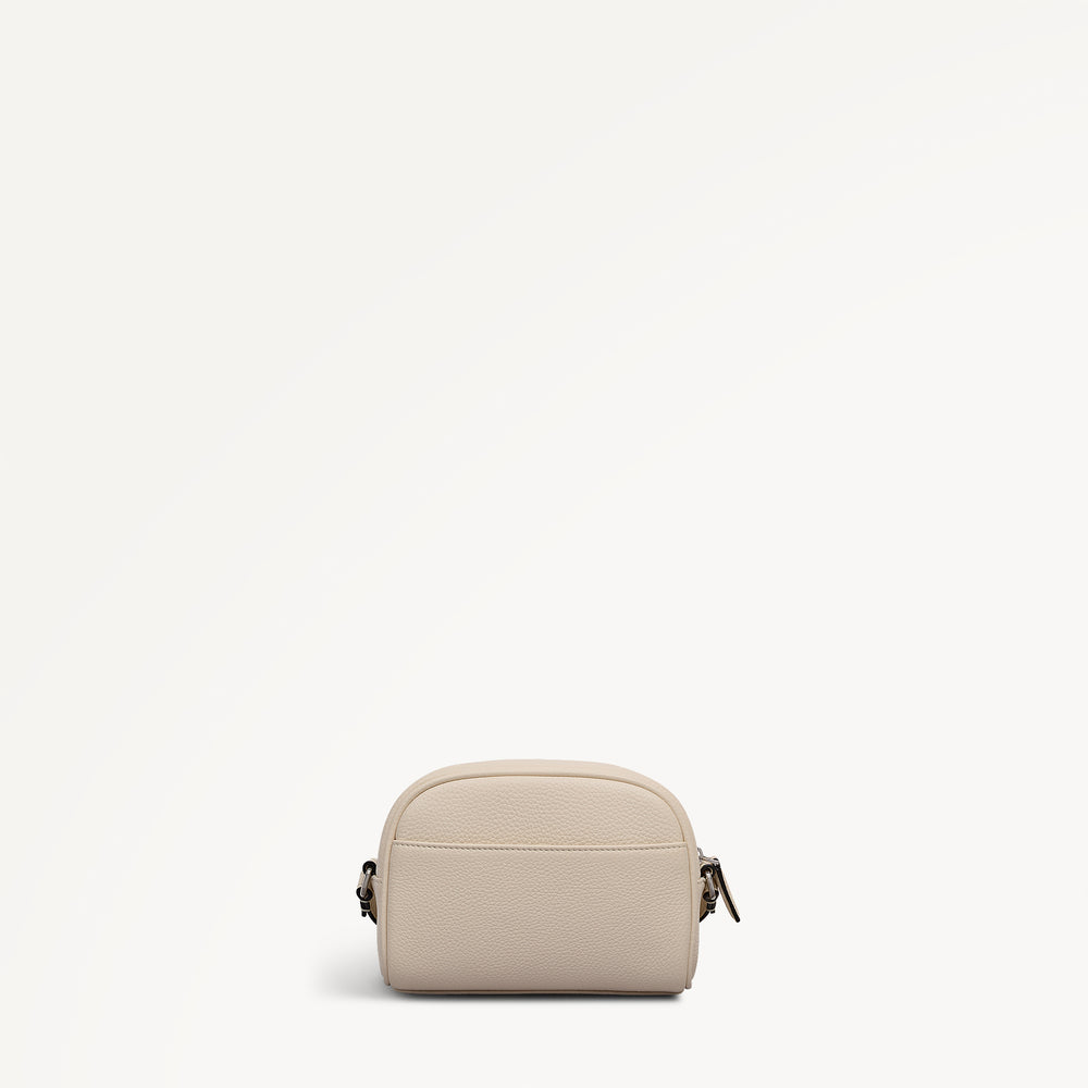 THE DAILY SMALL ZIP AROUND CROSS BODY SALT