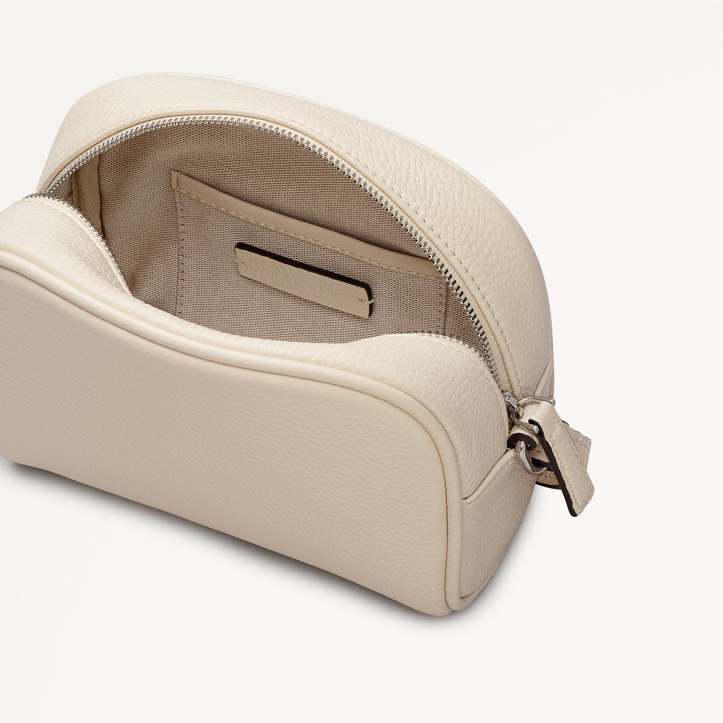 THE DAILY SMALL ZIP AROUND CROSS BODY SALT
