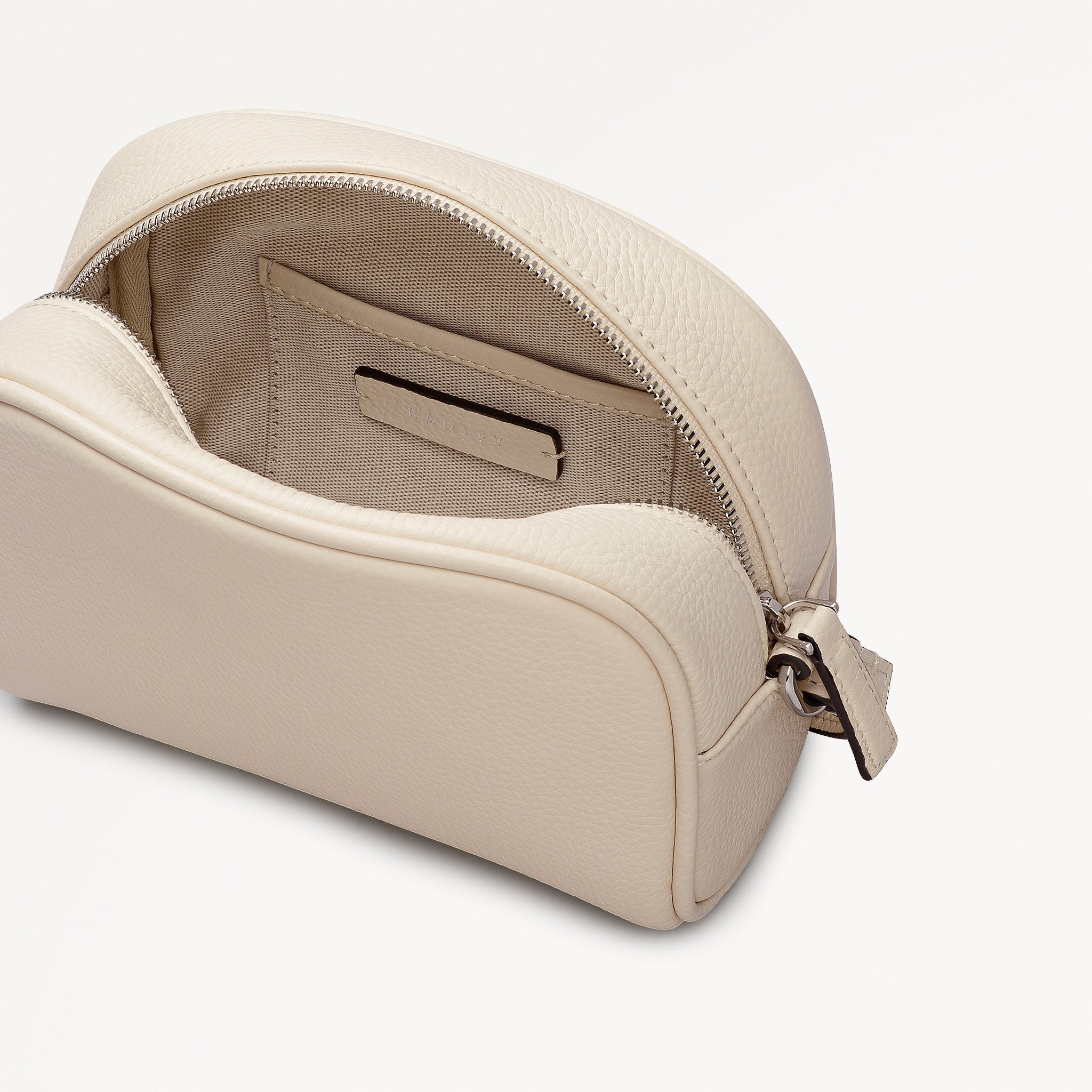 THE DAILY SMALL ZIP AROUND CROSS BODY SALT