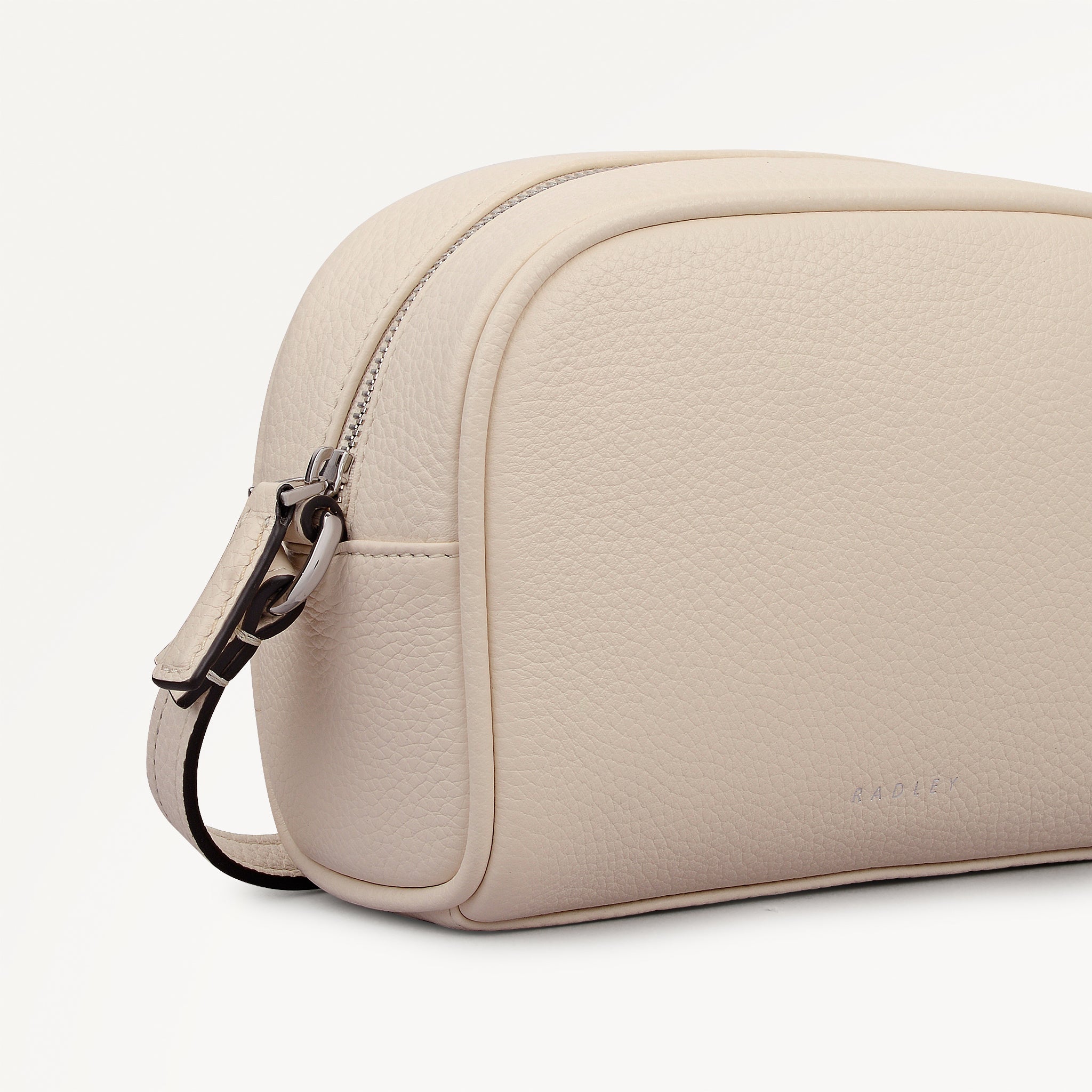 THE DAILY SMALL ZIP AROUND CROSS BODY SALT