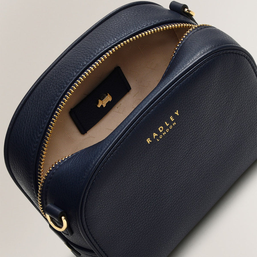 Arden Crescent Leather Small Zip Around Crossbody Bag in Ink - H1304401