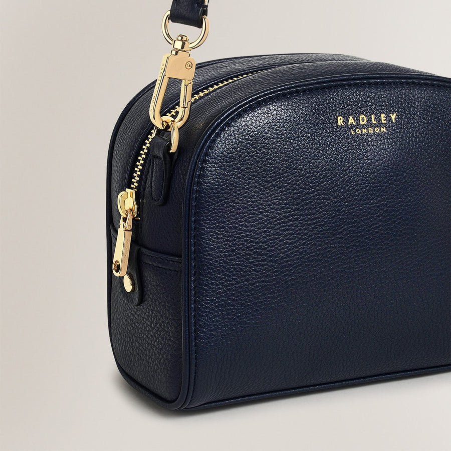 Arden Crescent Leather Small Zip Around Crossbody Bag in Ink - H1304401